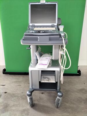 Ge Logiq E Portable Ultrasound Scanner *Mfd - Nov 2011* Software Version - R6.0.5 with 2 x Transducers / Probes (1 x 12L and 1 x 4C) on Docking Cart (Powers Up) *215321WX1* (Collection from Geldermalsen 4191, Netherlands Only)