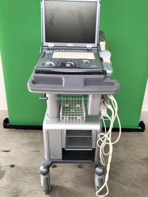 Ge Logiq E Portable Ultrasound Scanner *Mfd - 02/2012* Software Version - R6.0.4 with 3 x Transducers / Probes (1 x 12L, 1 x 3S and 1 x 4C) on Docking Cart (Powers Up) *224985WX2* (Collection from Geldermalsen 4191, Netherlands Only)