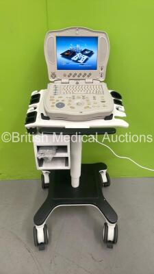 GE Logiq Book Portable Ultrasound Scanner Model No 2349935 *S/N 14925WX2* **Mfd 03/2004** Software Version R2.0.3 REV 1 on GE Mobile Cart (Powers Up - In Excellent Condition)