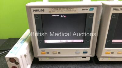 Job Lot Including 2 x Philips M3046A Patient Monitors (Both Power Up 1 x with Missing Module Clip - See Photo) and 2 x Philips M3001A Modules Including ECG, SpO2, NBP, Press and Temp Options - 2