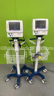 2 x Fukuda Denshi Dynascope DS-7100 Vital Signs Monitors on Stands (Both Power Up) *S/N 50002538 / 50002537*