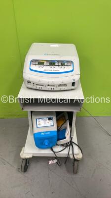 ConMed System 2450 Electrosurgical / Diathermy Unit on Stand with Dual Footswitch and ConMed AER Defense Suction Unit on Stand (Powers Up)