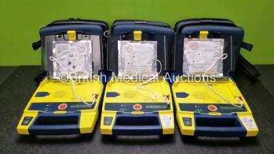 3 x Cardiac Science Powerheart AED G3 Automated External Defibrillators (All Power Up with Stock Battery Stock Battery Not Included) In Carry Case with 3 x In Date Electrode Packs