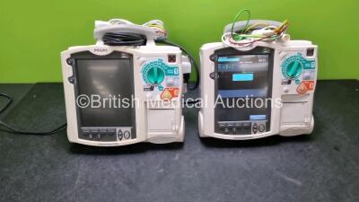 2 x Philips MRx Heartstart Defibrillators Including Pacer, ECG and Printer Options (Both Power Up) with 2 x 3 Lead ECG Leads, 1 x Paddle Leads and 1 x M3538A Module