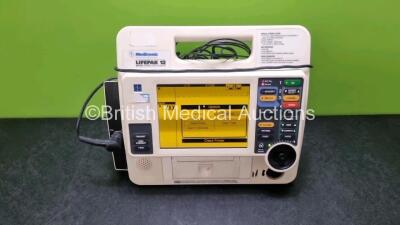 Medtronic Lifepak 12 Biphasic Defibrillator P/N VLP12-02-006565 (Powers Up with Service Light, User Test Failed, Faulty Printer) with 1 x 3 Lead ECG Lead