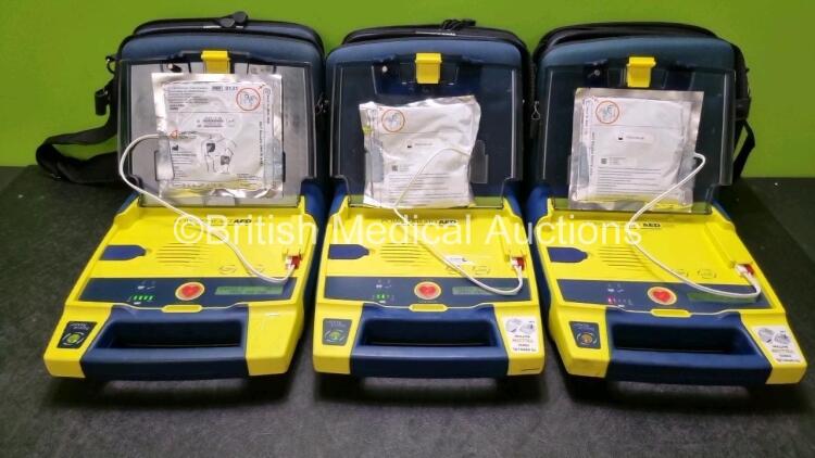 3 x Cardiac Science Powerheart AED G3 Automated External Defibrillators (All Power Up with Stock Battery Stock Battery Not Included) In Carry Case with 3 x In Date Electrode Packs