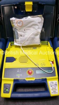 3 x Cardiac Science Powerheart AED G3 Automated External Defibrillators (All Power Up with Stock Battery Stock Battery Not Included) In Carry Case with 3 x In Date Electrode Packs - 3