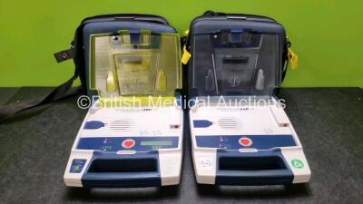 Job Lot Including 1 x Cardiac Science Powerheart AED G3 Automated External Defibrillator and 1 x Cardiac Science Firstsave AED G3 Defibrillator (Both Power Up with Stock Battery Stock Battery Not Included) In Carry Cases