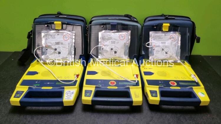 3 x Cardiac Science Powerheart AED G3 Automated External Defibrillators (All Power Up with Stock Battery Stock Battery Not Included) In Carry Case with 3 x In Date Electrode Packs