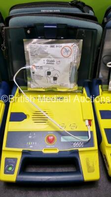 3 x Cardiac Science Powerheart AED G3 Automated External Defibrillators (All Power Up with Stock Battery Stock Battery Not Included) In Carry Case with 3 x In Date Electrode Packs - 3