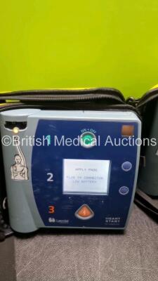 3 x Laerdal Heartstart FR2+ Defibrillators (All Power Up with Stock Batteries, Batteries Not Included) In Carry Cases - 3