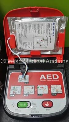 Job Lot Including 1 x Mediana Ref A15M-G4-0EH AED Defibrillator (Powers Up) 1 x Cardiac Science Responder Automated External Defibrillator In Carry Case (Powers Up with Stock Battery, Battery Not Included) and 1 x CU Medical Systems NF1200 Defibrillator I - 2