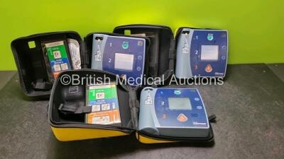 3 x Laerdal Heartstart FR2 Defibrillators (All Power Up with Stock Batteries, Batteries Not Included) In Carry Cases