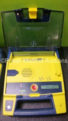 4 x Cardiac Science Powerheart AED G3 Automated External Defibrillators (All Power Up with Stock Batteries, Batteries Not Included, 1 x Requires Service) - 2