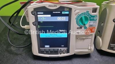 2 x Philips Heartstart MRx Defibrillators / Monitors Including ECG, and Printer Options (Both Power Up) with 2 x Paddle Leads, 1 x 3 Lead ECG Lead, 2 x Philips M3725A Test Loads, 1 x M3538A Battery and 1 x Philips M3539A Module - 4