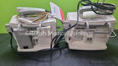 2 x Philips Heartstart MRx Defibrillators / Monitors Including ECG, and Printer Options (Both Power Up) with 2 x Paddle Leads, 1 x 3 Lead ECG Lead, 2 x Philips M3725A Test Loads, 1 x M3538A Battery and 1 x Philips M3539A Module - 6