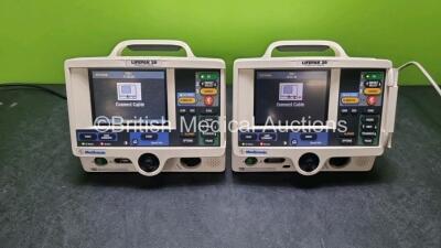 2 x Medtronic Lifepak 20 Defibrillator / Monitors (Both Power Up with Service Lights, 1 x Missing Door) Including Pacer, ECG and Printer Options