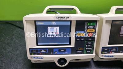 2 x Medtronic Lifepak 20 Defibrillator / Monitors (Both Power Up with Service Lights, 1 x Missing Door) Including Pacer, ECG and Printer Options - 3