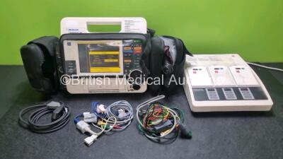 Job Lot Including 1 x Medtronic Lifepak 12 Biphasic Defibrillator / Monitor *Mfd 2002* P/N VLP12-02-003264 (Powers Up and Passes Self Test, Damage to Paddle Lead Connector - See Photo) Including Pacer, ECG and SpO2 Options with 2 x Batteries, 1 x BP Cuf