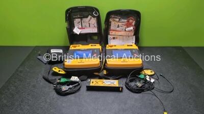 2 x Medtronic Physio Control Lifepak 1000 Defibrillators *Mfd 2008 / 2010* (Both Power Up) with 2 x 3 Lead ECG Lead and 3 x Physio Control 1000 Batteries *Li/Mn02*