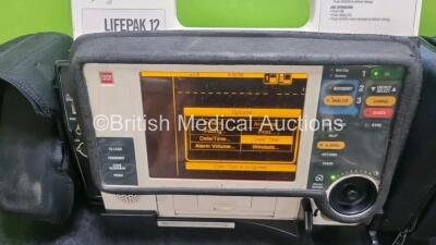 Job Lot Including 1 x Medtronic Lifepak 12 Biphasic Defibrillator *Mfd 2004* P/N VLP12-02-004437 (Powers Up and Passes Self Test) Including ECG, SpO2, NIBP Options with 1 x Ref 1111-000021 4 Lead ECG Lead, 2 x Batteries and 1 x Lifepak 12 Training Unit wi - 2