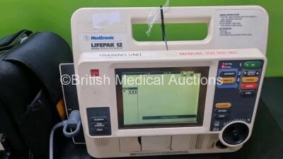 Job Lot Including 1 x Medtronic Lifepak 12 Biphasic Defibrillator *Mfd 2004* P/N VLP12-02-004437 (Powers Up and Passes Self Test) Including ECG, SpO2, NIBP Options with 1 x Ref 1111-000021 4 Lead ECG Lead, 2 x Batteries and 1 x Lifepak 12 Training Unit wi - 3