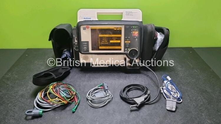 Medtronic Lifepak 12 Biphasic Defibrillator *Mfd 2008* P/N VLP12-02-007028 (Powers Up and Passes Self Test Slight Damage to Casing - See Photo) Including ECG, SpO2, NIBP Options with 1 x Ref 1111-000021 4 Lead ECG Lead, 1 x Ref 11111-000023 6 Lead ECG Lea