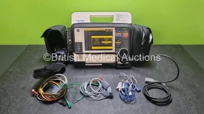 Medtronic Lifepak 12 Biphasic Defibrillator *Mfd 2004* P/N VLP12-02-004437 (Powers Up and Passes Self Test, Damage to Casing - See Photos) Including ECG, SpO2, NIBP Options with 1 x Ref 1111-000021 4 Lead ECG Lead, 1 x Ref 11111-000023 6 Lead ECG Lead, 2