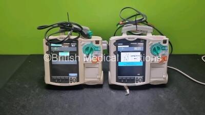 2 x Philips Heartstart MRx Defibrillators / Monitors Including ECG, and Printer Options (Both Power Up) with 2 x Paddle Leads, 1 x 3 Lead ECG Lead, 2 x Philips M3725A Test Loads, 1 x M3538A Battery and 1 x Philips M3539A Module