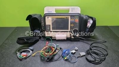 Medtronic Lifepak 12 Biphasic Defibrillator *Mfd 2004* P/N VLP12-02-005382 (Powers Up and Passes Self Test, Damage to Casing - See Photos) Including ECG, SpO2, NIBP Options with 1 x Ref 1111-000021 4 Lead ECG Lead, 1 x Ref 11111-000023 6 Lead ECG Lead, 2 