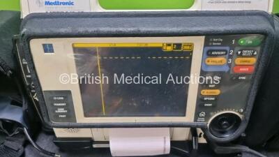 Medtronic Lifepak 12 Biphasic Defibrillator *Mfd 2004* P/N VLP12-02-005382 (Powers Up and Passes Self Test, Damage to Casing - See Photos) Including ECG, SpO2, NIBP Options with 1 x Ref 1111-000021 4 Lead ECG Lead, 1 x Ref 11111-000023 6 Lead ECG Lead, 2 - 2