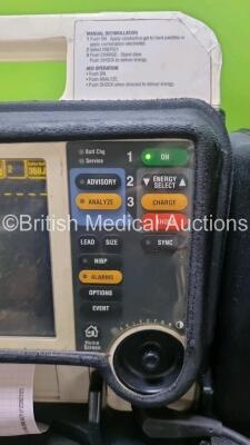 Medtronic Lifepak 12 Biphasic Defibrillator *Mfd 2004* P/N VLP12-02-005382 (Powers Up and Passes Self Test, Damage to Casing - See Photos) Including ECG, SpO2, NIBP Options with 1 x Ref 1111-000021 4 Lead ECG Lead, 1 x Ref 11111-000023 6 Lead ECG Lead, 2 - 4