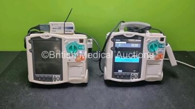 2 x Philips Heartstart MRx Defibrillators / Monitors Including ECG, and Printer Options (Both Power Up) with 2 x Paddle Leads, 2 x Philips M3725A Test Loads and 1 x Philips M3539A Module