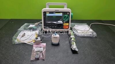 Philips Efficia DFM100 Defibrillator *Mfd 2020* (Powers Up) Including Pacer, ECG, CO2 and Printer Options with , 1 x Philips CO2 Sensor Module 1 x 3 Lead ECG Lead, 1 x Paddle Lead *SN CN32640149*