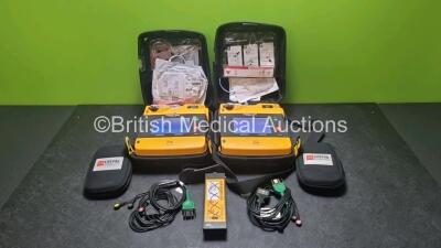 2 x Medtronic Physio Control Lifepak 1000 Defibrillators *Mfd 2016 / 2018* (Both Power Up) with 2 x 3 Lead ECG Lead , 3 x in Date Electrode Packs and 3 x Physio Control 1000 Batteries *Li/Mn02*