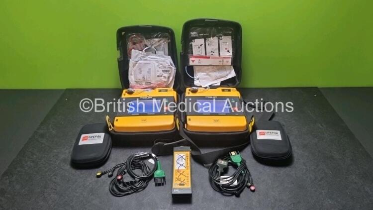 2 x Medtronic Physio Control Lifepak 1000 Defibrillators *Mfd 2016 / 2018* (Both Power Up) with 2 x 3 Lead ECG Lead , 3 x in Date Electrode Packs and 3 x Physio Control 1000 Batteries *Li/Mn02*