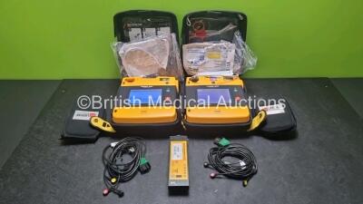 2 x Medtronic Physio Control Lifepak 1000 Defibrillators *Mfd 2021 / 2017* (Both Power Up) with 2 x 3 Lead ECG Lead , 4 x in Date Electrode Packs and 3 x Physio Control 1000 Batteries *Li/Mn02*