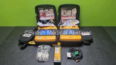 2 x Medtronic Physio Control Lifepak 1000 Defibrillators *Mfd 2008 / 2009* (Both Power Up 1 x Crack In Screen - See Photo) with 2 x 3 Lead ECG Lead , 2 x in Date Electrode Packs and 3 x Physio Control 1000 Batteries *Li/Mn02*