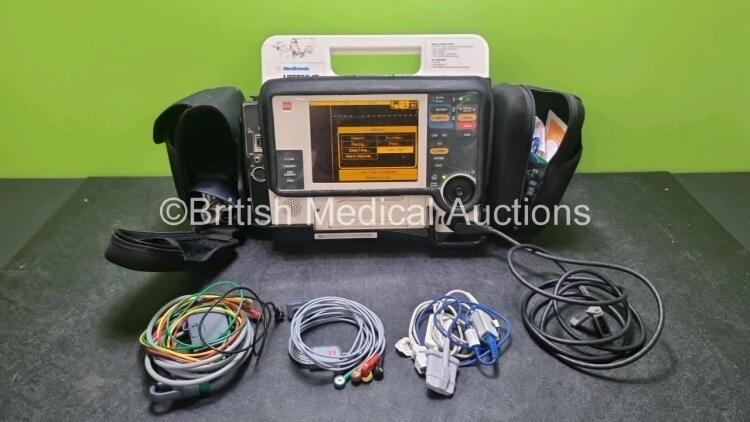 Medtronic Lifepak 12 Biphasic Defibrillator *Mfd 2007* P/N VLP12-02-006555 (Powers Up and Passes Self Test, Slight Damage to Casing - See Photos) Including ECG, SpO2, NIBP Options with 1 x Ref 1111-000021 4 Lead ECG Lead, 1 x Ref 11111-000023 6 Lead ECG L