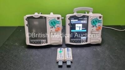 2 x Philips Heartstart MRx Defibrillators / Monitors Including ECG, and Printer Options (Both Power Up, 1 x Missing Handle) with 2 x Philips M3725A Test Loads, 1 x M3538A Battery and 1 x Philips M3539A Module