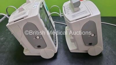 2 x Philips Heartstart MRx Defibrillators / Monitors Including ECG, and Printer Options (Both Power Up, 1 x Missing Handle) with 2 x Philips M3725A Test Loads, 1 x M3538A Battery and 1 x Philips M3539A Module - 6