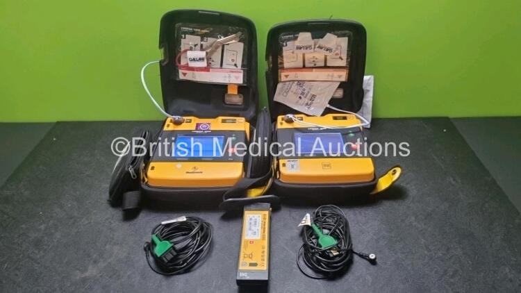 2 x Medtronic Physio Control Lifepak 1000 Defibrillators *Mfd 209 / 2011* (Both Power Up 1 x Crack In Screen - See Photo) with 2 x 3 Lead ECG Lead , 3 x in Date Electrode Packs and 3 x Physio Control 1000 Batteries *Li/Mn02*