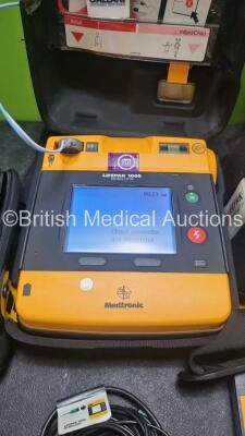 2 x Medtronic Physio Control Lifepak 1000 Defibrillators *Mfd 209 / 2011* (Both Power Up 1 x Crack In Screen - See Photo) with 2 x 3 Lead ECG Lead , 3 x in Date Electrode Packs and 3 x Physio Control 1000 Batteries *Li/Mn02* - 3