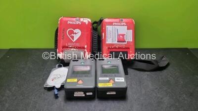 2 x Philips Heartstart FR3 Defibrillators (Both Power Up with Stock Battery, Stock Battery Not Included) In Carry Cases *SN C12F00389 / C12F00629*