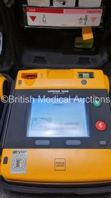 2 x Medtronic Physio Control Lifepak 1000 Defibrillators *Mfd 2021 / 20198 (Both Power Up) with 2 x 3 Lead ECG Lead and 4 x Physio Control 1000 Batteries *Li/Mn02* - 2