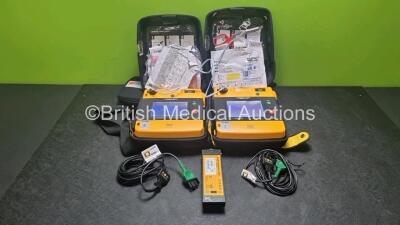 2 x Medtronic Physio Control Lifepak 1000 Defibrillators *Mfd 2017 / 2021* (Both Power Up 1 x with Marks on Screen - See Photo) with 2 x 3 Lead ECG Lead , 4 x in Date Electrode Packs and 3 x Physio Control 1000 Batteries *Li/Mn02*