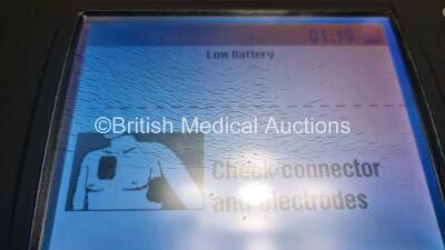 2 x Medtronic Physio Control Lifepak 1000 Defibrillators *Mfd 2017 / 2021* (Both Power Up 1 x with Marks on Screen - See Photo) with 2 x 3 Lead ECG Lead , 4 x in Date Electrode Packs and 3 x Physio Control 1000 Batteries *Li/Mn02* - 7