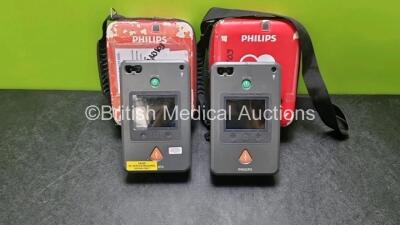 2 x Philips Heartstart FR3 Defibrillators (Both Power Up with Stock Battery, Stock Battery Not Included) In Carry Cases *SN C12F00389 / C12F00629*