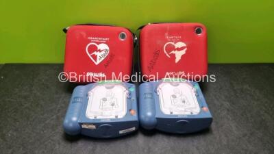 2 x Philips Heartstart HS1 Defibrillators (Both Power Up) with 1 x M5070A Battery *Install Before 03-2023* In Carry Cases *SN A09D01783 / A0JJ00332*