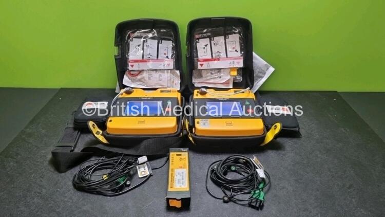 2 x Medtronic Physio Control Lifepak 1000 Defibrillators *Mfd 2016 / 2018* (Both Power Up) with 2 x 3 Lead ECG Lead , 3 x in Date Electrode Packs and 3 x Physio Control 1000 Batteries *Li/Mn02*